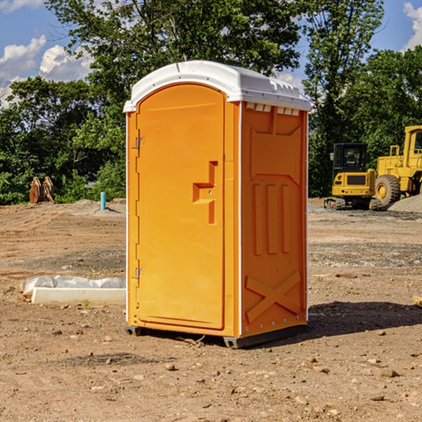 how often are the portable restrooms cleaned and serviced during a rental period in Green